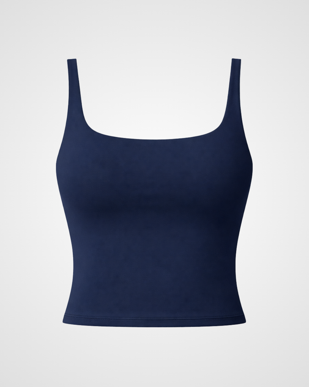 Navy blue activewear tank top with square neckline laid flat in minimalist styling by Nuude
