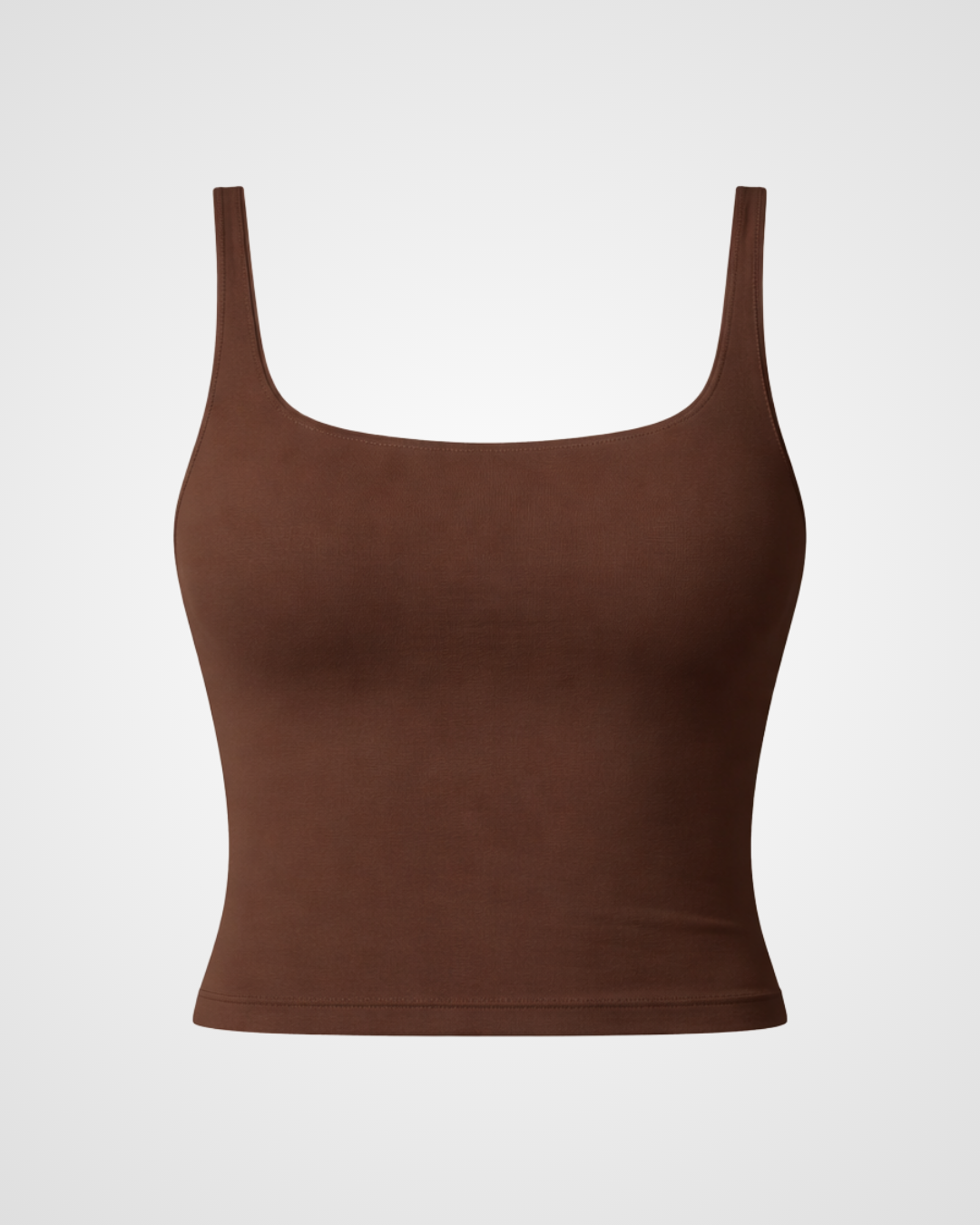 Tasty terra square neck activewear tank laid flat with minimalist styling by Nuude